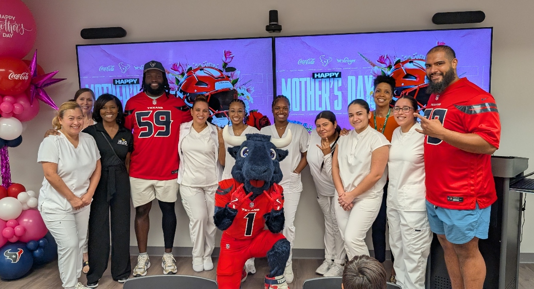 HCC Esthetics students and Cosmetology staff pose with Houston Texans offensive guard Kenyon Green (#59), and center Juice Scruggs (#70) before providing facials and hand massages to Family Houston clients during a pre-Mother’s Day community outreach event sponsored by the Houston Texans to pamper deserving local mothers.