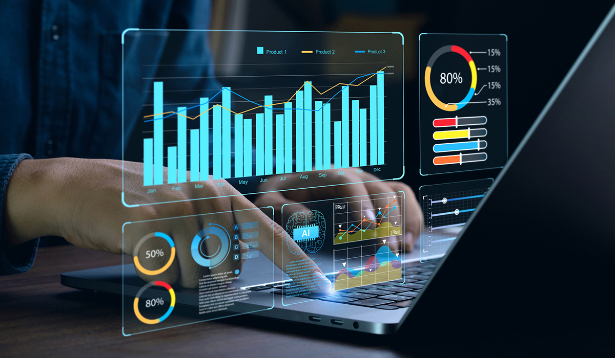 Data Analyst using laptop to review graphs